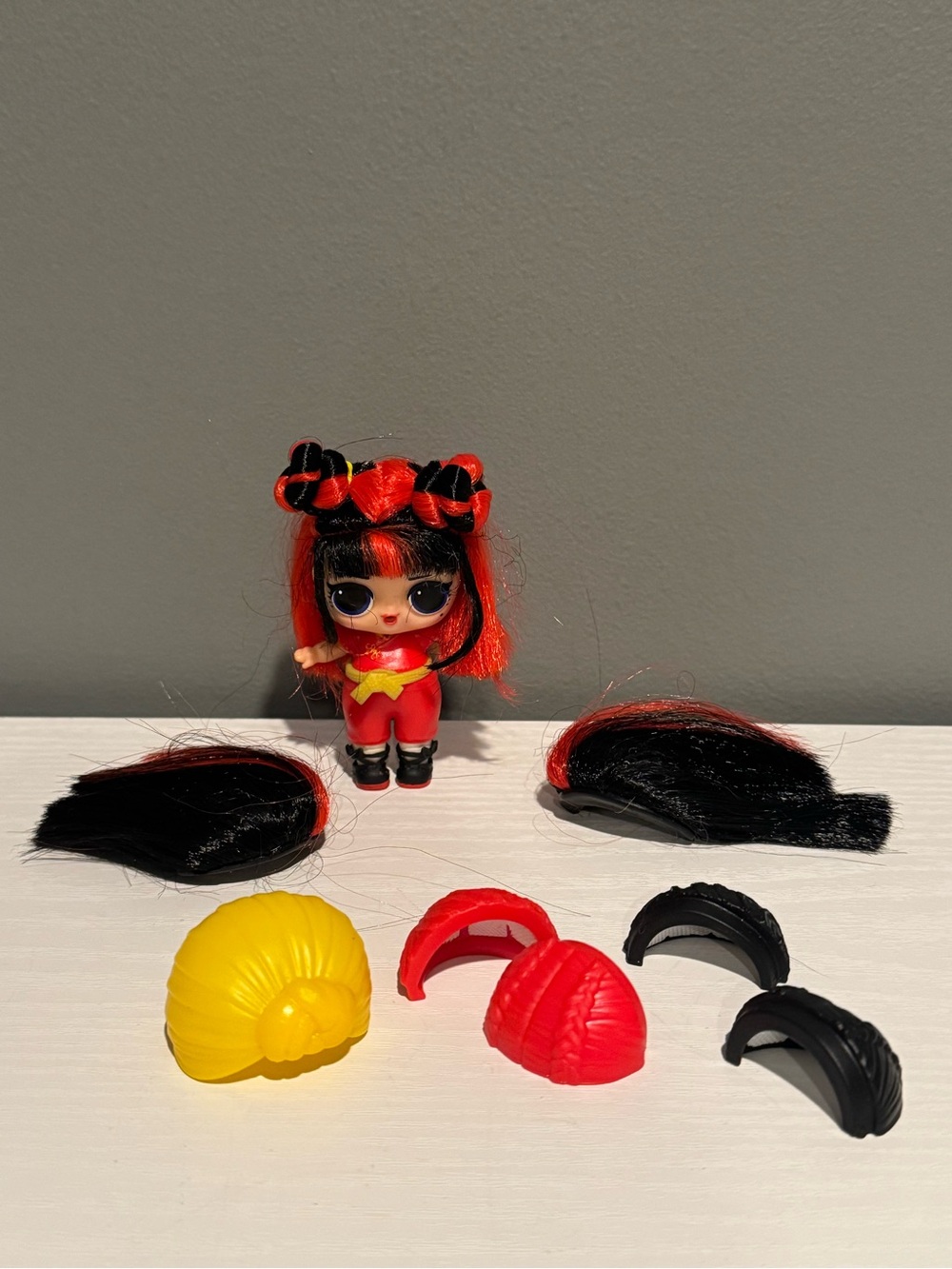 2 inch LOL doll “black belt” doll includes wigs.